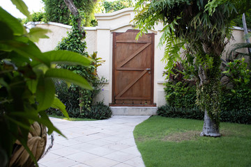 Fototapeta na wymiar Wooden door in the garden