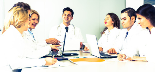 doctors in negotiations in conference room