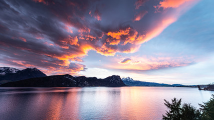 Dynamic sunset over the mountains and the lake. Switzerland. Lucerne.