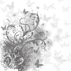 Black and white illustration, grass with flowers and butterflies.