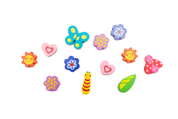 Top view with colorful wooden baby toys on isolated white background.