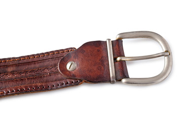 old, used brown leather belt on a white background