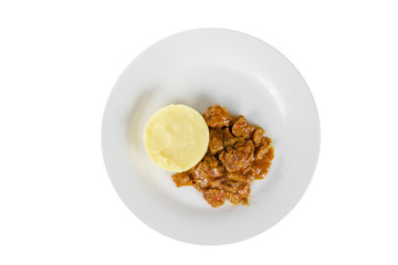 goulash from beef, pork, lamb meat with side dish mash potato on a plate isolated white background. Juicy fillet, roast. For the menu bar, restaurant, cafe View from above