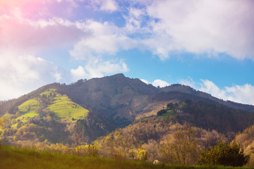 Beautiful mountains on a sunny day. View of the mountains against a blue cloudy sky. Beautiful nature landscape. Europe, Spain. Blue colored