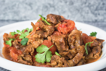 Goulash, beef stew in cast iron pan, top view, close up