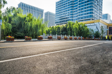 Obraz premium city road through modern buildings in beijing