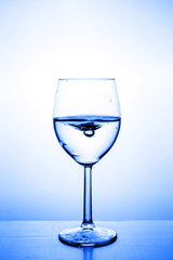 Glass with water up and splash