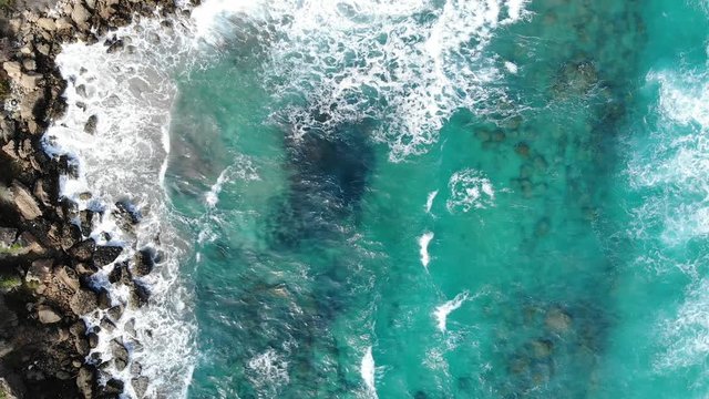 Drone view of blue azure water of sea in Cyprus, waves and island background