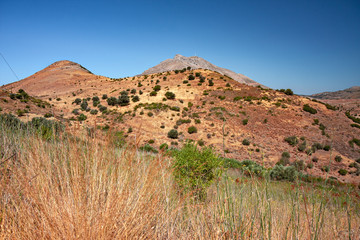 Panoramic view of the mountainous and wild landscape of the southern coast of Crete in Greece.