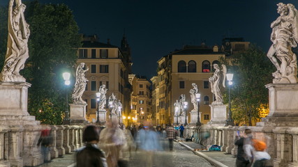 Fototapeta premium Stunning Ponte Sant'Angelo bridge timelapse crossing the river Tiber near Castel Sant'Angelo in Rome.