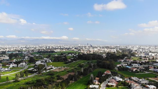 Drone view of Nicosia capital city and green parks, Cyprus