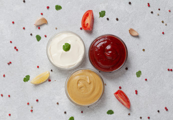 Set of sauces - mustard, ketchup, mayonnaise. Top view. 