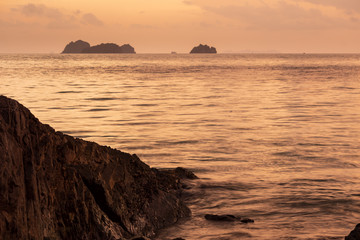 Spectacular sunset over cliffs on the beach