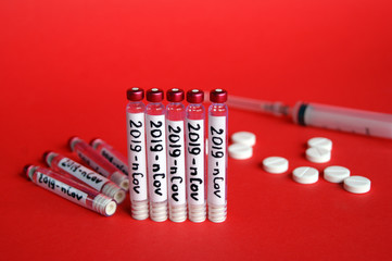 2019-nCoV Coronavirus concept. Syringe and ampoules with a vaccine against the virus