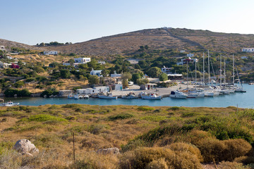Fototapeta na wymiar Arki island, the small village and his port surrounded by taverns. Aegean sea, Dodecanese Islands, Greece