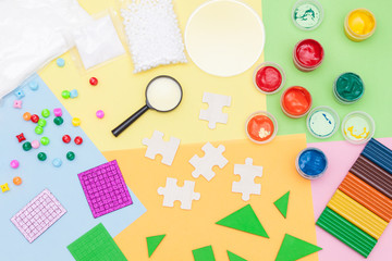 Materials used for kids crafts, art, experiments and education. Flat lay. Creativity for kids. Top view colorful background.