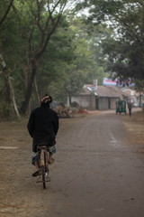 Old man is driving a cycle