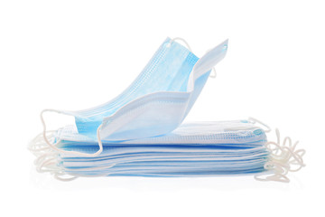 Respirator or surgical masks with elastic ear loops in stack isolated on white. Defend individual household  protection or coronavirus or aerosols infection disease