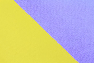 Abstract geometric water color paper background in soft pastel yellow and purple trend colors with diagonal line.