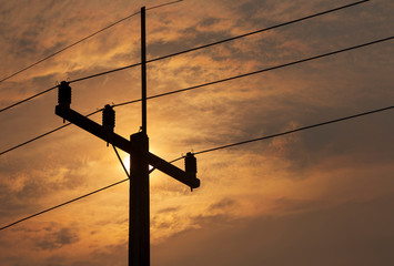 Electric pole with sunset sky