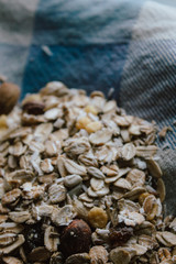 Muesli with nuts for bulk breakfast. Sustainable product in bulk on local typical recycled fabric.