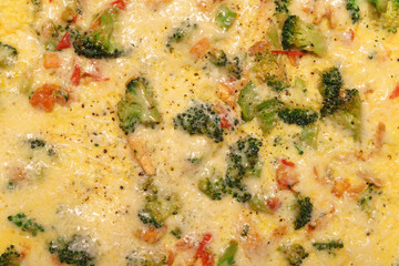 Italian cuisine - frittata with vegetables. Close-up view from above. Food Background