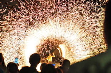 Fire show performance at a beachfront restaurant in Thailand tourist attraction