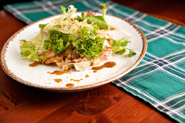 side view. a salad closeup on a white plate. 