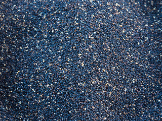 A large number of black and white peeled seeds.