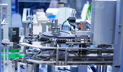 pharmaceutical industry. Production line machine conveyor at factory with bottles