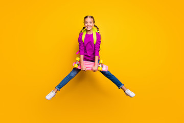 Fototapeta na wymiar Full length body size view of her she nice attractive glad cheerful cheery girl jumping carrying longboard pass exam test isolated on bright vivid shine vibrant yellow color background