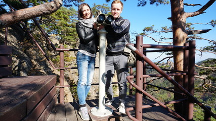 Couple of travelers on the top of mountain at honeymoon in a Seoraksan National Park in South Korea, Asia.