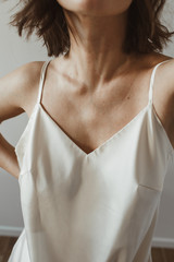 Fototapeta na wymiar Closeup of young beautiful woman in silk underwear. Fashion concept.