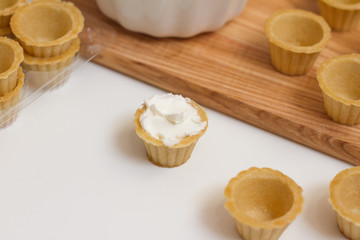 Tartlets with custard or cottage cheese.
