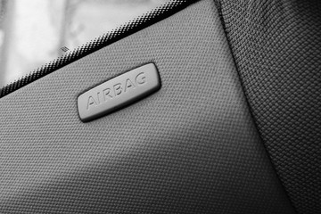 Close up photo inside a car, airbag sign isolated.