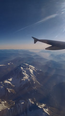 Fototapeta premium view from the height of the Mont Blanc mountains and the wing of the plane on a clear cloudless day