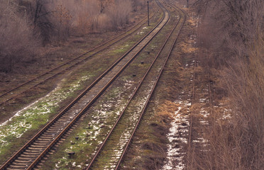 Fototapeta na wymiar Abandoned empty railway. Forlorn railroad