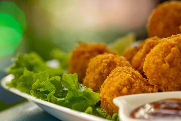 Closeup on chicken nuggets on a plate