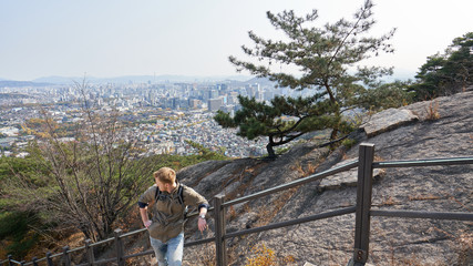 Traveller on the top of Inwangsan Mountain in Seoul in South Korea.