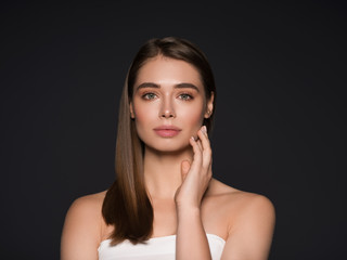 Beauty woman hand touching skin natural skin hair Studio shot of a beautiful young woman posing...