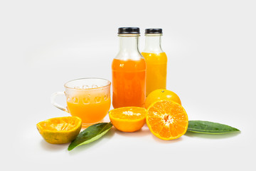 Glass of orange juice  with bottle on white background. Fruit for health