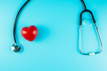 Top view Stethoscope with Red heart shape on blue background with copy space for text. Healthcare,...
