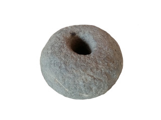 Ancient sandstone tool isolated on white background, Old stone tool. The stone has a rounded shape with a hole in the middle.