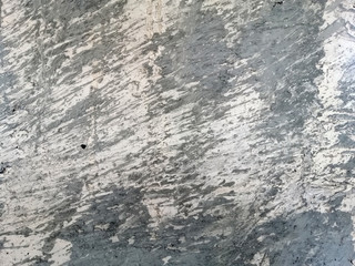 Abstract and texture of embossing on the cement surface caused by flicking the plastering trowel.