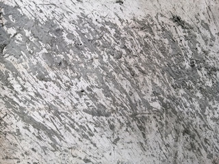 Abstract and texture of embossing on the cement surface caused by flicking the plastering trowel.