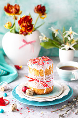 Traditional cupcake Easter cake. Easter cake, colored eggs and spring flowers. vertical