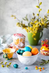 Traditional cupcake Easter cake. Easter cake, colored eggs and spring flowers. vertical
