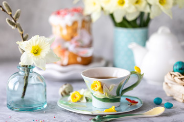 Traditional cupcake Easter cake. Easter cake, colored eggs and spring flowers.