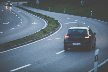 Cars on a highway at sunset (shallow DOF; color toned image)
