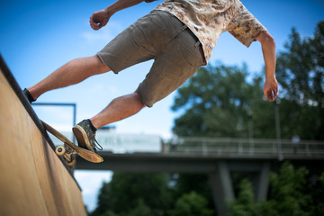 Skteboarder riding in an U ramp in a skatepark (motion blurred image)